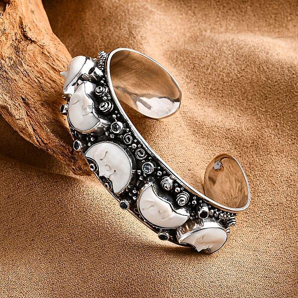 Bali Legacy Carved Bone And Blue Topaz 1.20 Ctw Moon Cuff Bracelet In Sterling Silver (8.00In)