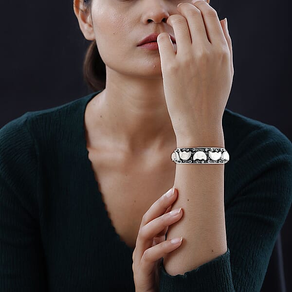 Bali Legacy Carved Bone And Blue Topaz 1.20 Ctw Moon Cuff Bracelet In Sterling Silver (8.00In)