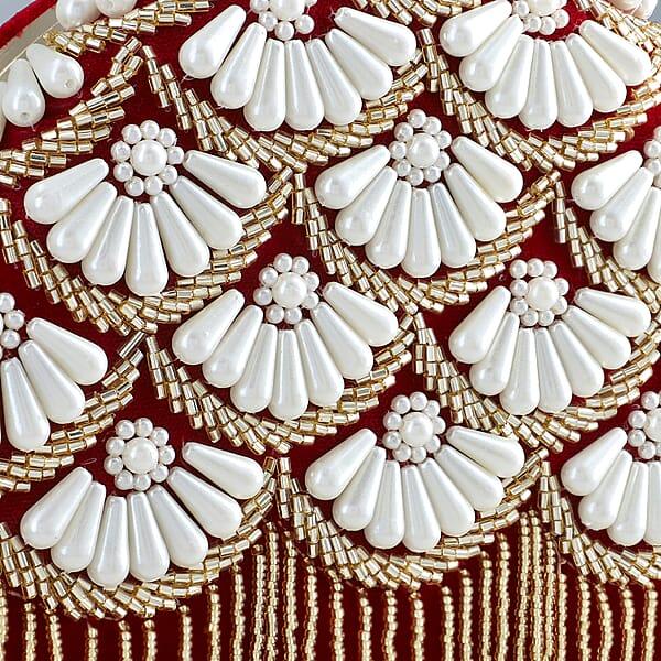 Burgundy Hand Embroidery Pearl Studded Velvet Clutch With Tassels Ring Handle And Sling Chain