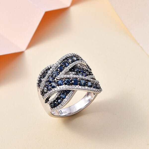 Ceylon Blue Sapphire And Moissanite 3.85 Ctw Overbridge By-pass Ring In Rhodium Over Sterling Silver (Size 6.0)
