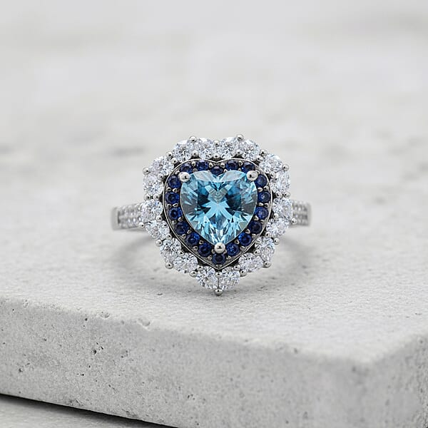 D'Joy Blue And White Moissanite And Blue Sapphire 3.10 Ctw Crowned Heart Glow Ring In Rhodium Over Sterling Silver
