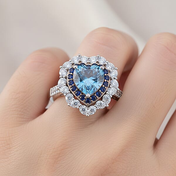 D'Joy Blue And White Moissanite And Blue Sapphire 3.10 Ctw Crowned Heart Glow Ring In Rhodium Over Sterling Silver