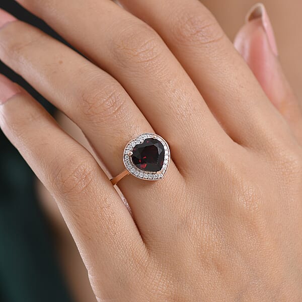 D'Joy Mozambique Garnet And Moissanite 3.90 Ctw Heartfire Glow Ring In 18K Vermeil Rose Gold Over Sterling Silver