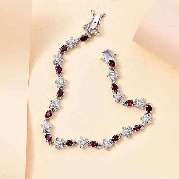 D'Joy Premium Anthill Garnet And Moissanite 6.00 Ctw Flower Bracelet In Rhodium Over Sterling Silver (8.00 In)