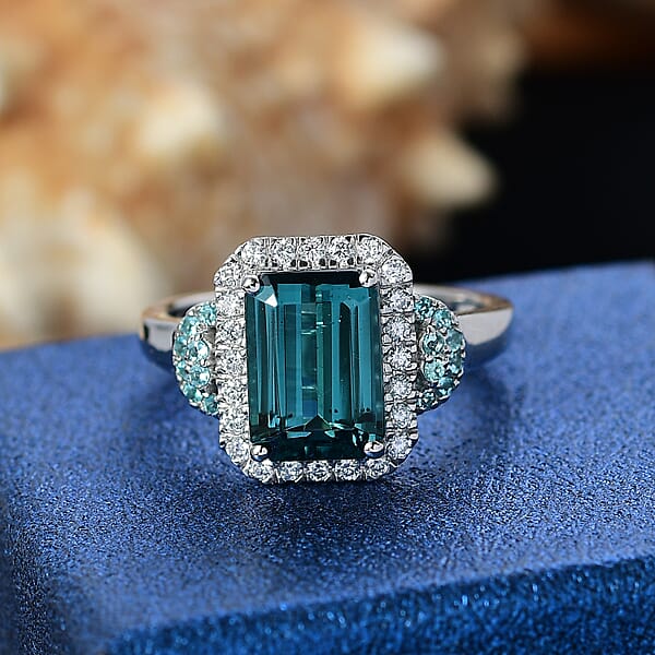Rhapsody 950 Platinum AAAA Lagoon Tourmaline Paraiba Tourmaline And Diamond (E-F VS2) (0.41 Cts) Halo Ring (7.90 G) 4.16 Ctw
