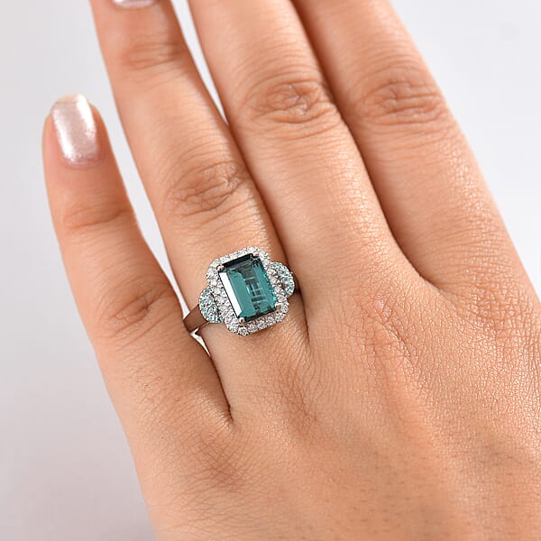 Rhapsody 950 Platinum AAAA Lagoon Tourmaline Paraiba Tourmaline And Diamond (E-F VS2) (0.41 Cts) Halo Ring (7.90 G) 4.16 Ctw
