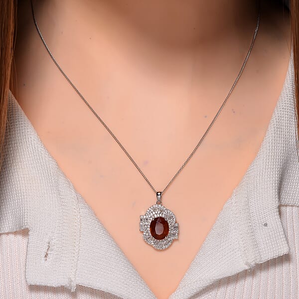 Tangerine Kyanite And Moissanite 5.00 Ctw Swirl Halo Pendant Necklace In Rhodium Over Sterling Silver 20 Inches